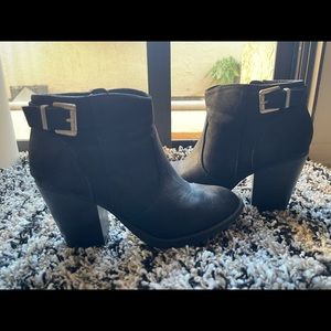 Black booties with gold buckle